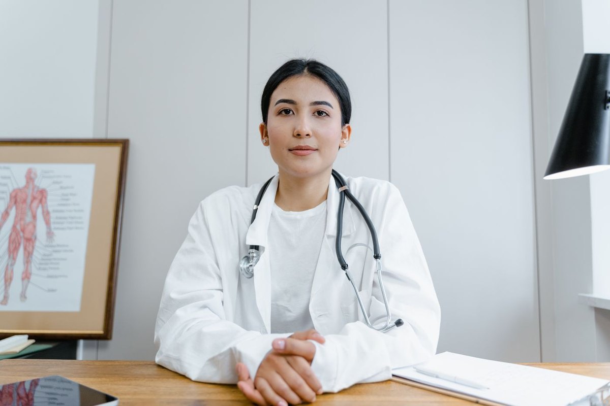 Doctor explaining IVF success rates and statistics to a couple